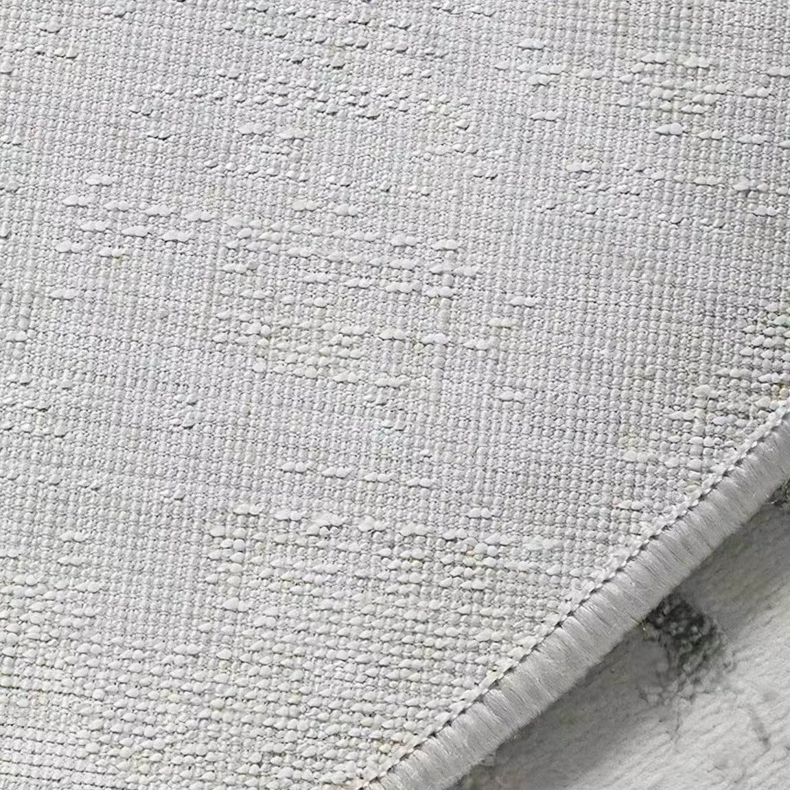 Perfect for a monochrome room. Stylish grey Wilton woven rug (HALFHALF) 